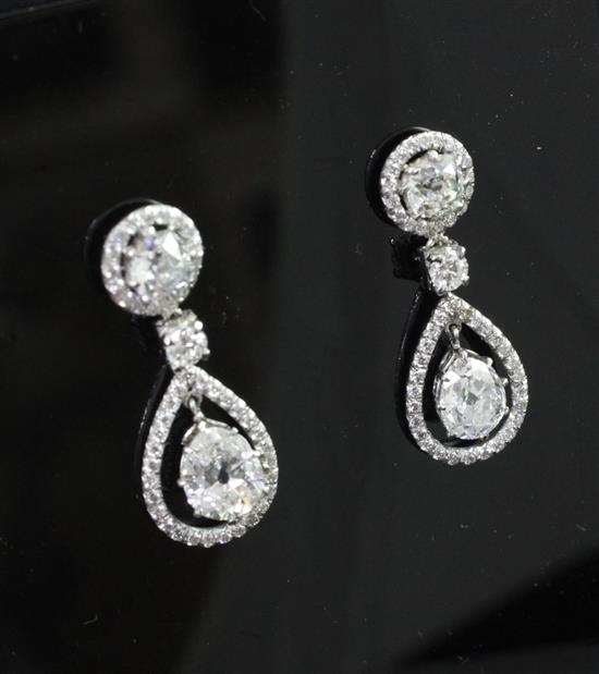 An attractive pair of platinum and diamond drop earrings, 30mm.